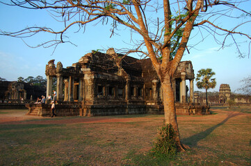 Naklejka premium Ancient ruins antique building castle Khmer Empire of Angkor Wat for cambodian people and foreign travelers travel visit respect praying in largest religious temple city complex in Siem Reap, Cambodia