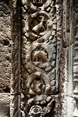 Naklejka premium Sculpture carving story khmer Empire on wall in Prasat Ta Prohm or Ancestor Brahma temple of Angkor Thom Wat for cambodian people foreign travelers travel visit at Siemreap city in Siem Reap, Cambodia