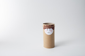 Recycled cardboard figurine highlighting sustainable crafting for holiday decorations, DIY project planners, eco-conscious businesses, and educational or artistic programs for children,