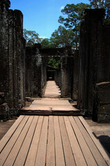 Fototapeta premium Sculpture carving ancient ruins antique building of Prasat Bayon Castle or Jayagiri Brahma Temple for Cambodian people and travelers travel visit respect pray at Angkor Thom Wat in Siem Reap, Cambodia