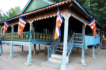 Fototapeta premium Wooden pavilion ubosot of ancient ruins Prasat West Mebon temple in reservoir West Baray or Baray Teuk Thla for Cambodian people and traveler travel visit at Angkor Thom Wat in Siem Reap, Cambodia