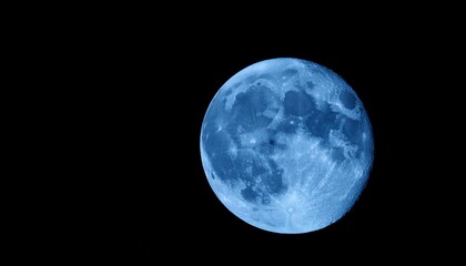 Obraz premium blue super moon isolated on black background