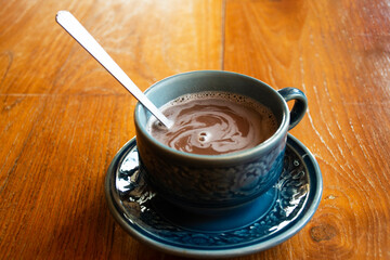 Hot ovaltine chocolate cocoa served in ceramic glass cup for travelers thai people rest relax eat and drinks at cafe restaurant shop in Bangkok, Thailand