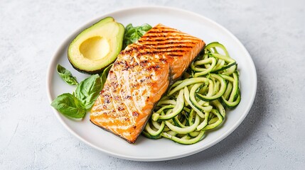 Grilled salmon with zucchini noodles and avocado healthy meal home kitchen culinary close-up