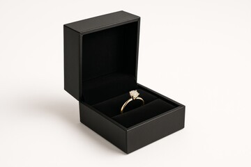 Elegant Gold Ring Inside a Black Jewelry Box, Minimalist Design for a Special Occasion