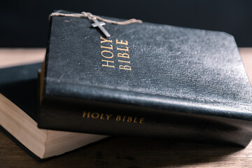 Religious belief concept Close up prayer Christian church service Bible Holy cross Spiritual power Blurred background Desk copy space Heaven God Catholic faith Praise book Jesus worship Gospel symbols