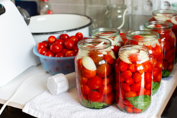 Homemade tomato preserves and tomato juice, canned and sealed for winter storage, maintaining flavor and freshness