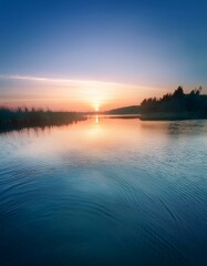 Fototapeta premium 夜明けの静かな池の水面に広がる、柔らかなグラデーションが特徴の波紋テクスチャ