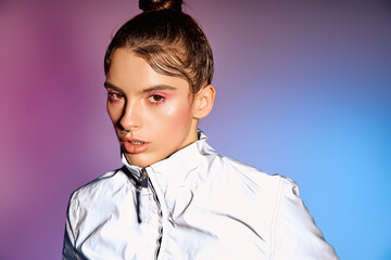 Stylish woman showcases modern fashion against a vibrant holographic backdrop at twilight