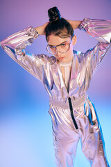 Stylish woman showcases holographic fashion in futuristic setting with vibrant colors and flair