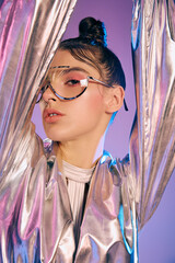 Futuristic woman showcasing holographic fashion in a vibrant and stylish setting