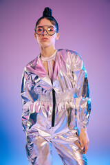 Stylish woman in holographic attire showcases vibrant fashion in a modern futuristic setting