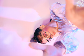 Futuristic fashion statement with holographic colors in a vibrant urban setting