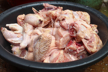 Close up of fresh raw chicken meat that has been cut into pieces