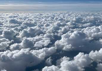 Fototapeta premium Aerial View of Cumulus Cloudscape - Endless White Clouds from Above