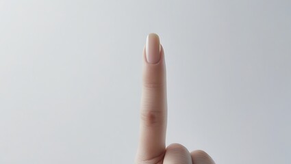 Pointing the Way: A close-up shot of a single finger pointing upwards, a minimalist shot that captivates attention with its simplicity.