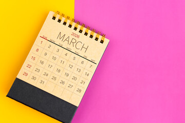 March 2026 desk calendar made from brown paper page on multicolor paper.