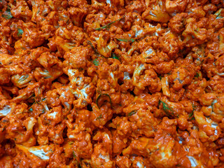 Close-Up of Spicy Seasoned Cauliflower Dish Garnished With Fresh Herbs