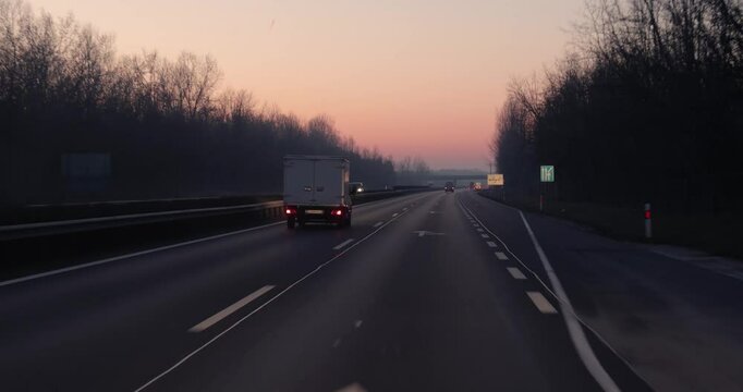 Highway driving view at dawn