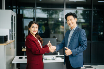 Two confident business man shaking hands during a meeting in the office, success, dealing, greeting and partner