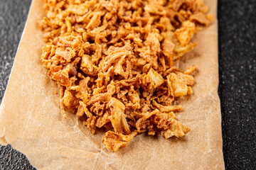 Fried onion crispy onions appetizer vegetables dish fresh delicious gourmet food background on table rustic food top view copy space vegetarian and vegan food
