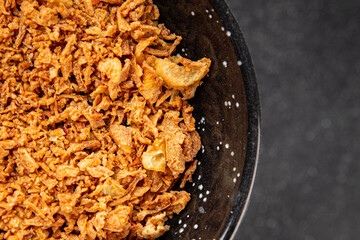 Fried onion crispy onions appetizer vegetables dish fresh delicious gourmet food background on table rustic food top view copy space vegetarian and vegan food