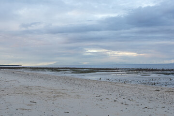 The row of high mountains on Flores Island is clearly visible from Waingapu on Sumba Island