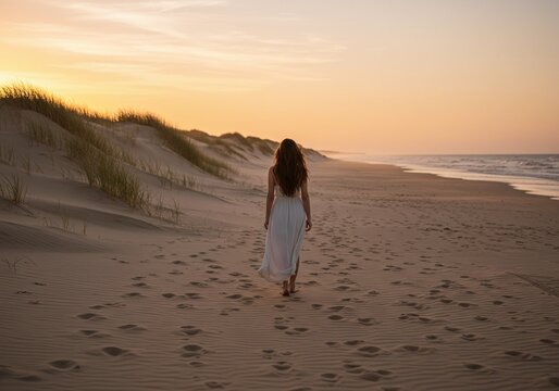 A woman walking alone along a sandy beach at sunset, enjoying a moment of peace and tranquility. The setting sun casts a warm glow over the scene.