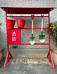 Stand with for fire fighting equipment in China. Sign in Chinese means ''Fire Control'' or ''Fire Fighting''.