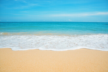 Fototapeta premium Beautiful blue ocean wave with sand beach background