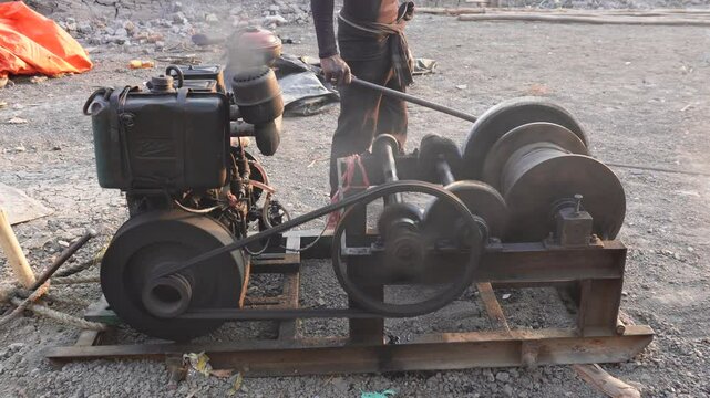 A person is operating heavy machine lever on the constriction site