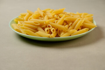Delightful display of freshly cooked penne pasta on a vibrant plate