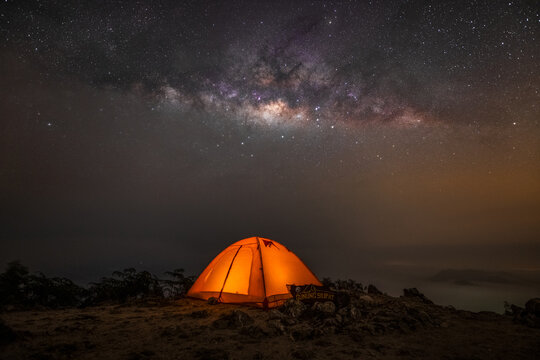 Magical Night at Gunung Silipat &ndash; A glowing tent under the breathtaking Milky Way, where adventure meets serenity.