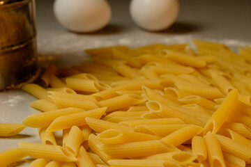Freshly made pasta and eggs awaiting culinary transformation in the kitchen