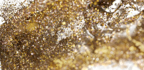 Abstract gold and brown glitter explosion background. Perfect for festive designs.