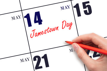 May 14. Hand writing text Jamestown Day on calendar date. Save the date.