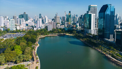 Aerial view modern office building with tropical green tree park in Benchakitti public park downtown