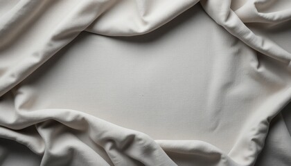Elegant white fabric draped over soft surface indoor setting textile photography minimalist environment close-up perspective textural exploration