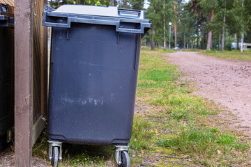 Garbage trash bin in a forest area. Waste management in mature Waste sorting management in an camping. Sustainable waste disposal system. Outdoor trash storage. Finland, Kymenlaakso, Hamina