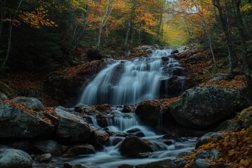 Serene autumn waterfall cascading through colorful forest grove