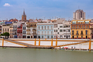 Naklejka premium Colorful riverside houses in Seville Spain