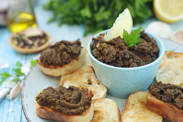 A bowl with tapenade - traditional olive dip in Mediterranean region	