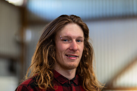 head and shoulders young man in shed looking at camera