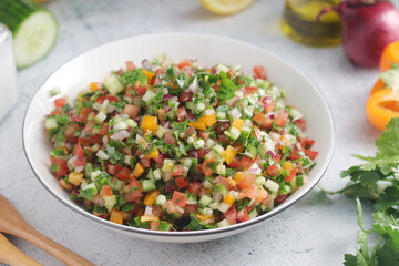 A bowl with traditional Israeli Salad
