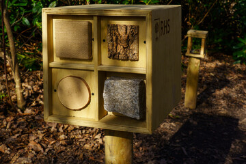 This rustic wooden box with earth textures is perfect for outdoor sensory play and nature exploration.
