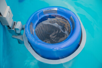 Cleaning filter in the clear pool water.