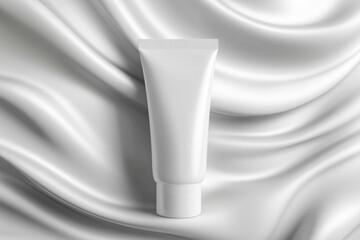 Close-up of a blank white cosmetic tube against a white fabric background, ideal for a mockup.