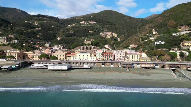 Europe, Italy, Liguria , Bonassola is a  sea village in province of Spezia in Gulf of Tigullio  , Drone  view of seafront with  pedestrian and cycle path through the tunnels from Levanto to Framura 