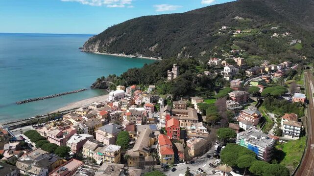 Europe, Italy, Liguria , Bonassola is a  sea village in province of Spezia in Gulf of Tigullio  , Drone  view of seafront with  pedestrian and cycle path through the tunnels from Levanto to Framura 