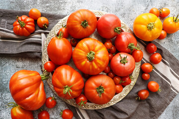 Flat-lay of fresh colorful ripe  heirloom tomatoes,   top view, copy space. Local market seasonal produce